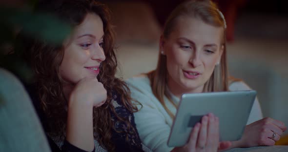 Portrait of Two Female Friends Doing Online Shopping