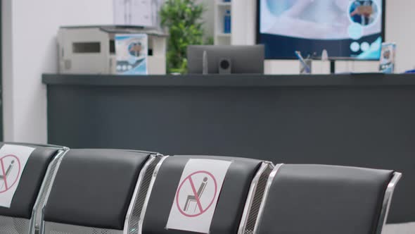 Nobody in Hospital Reception Lobby with Empty Chairs