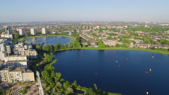 Aerial video of Woodberry Down lake, London, England on a sunny day