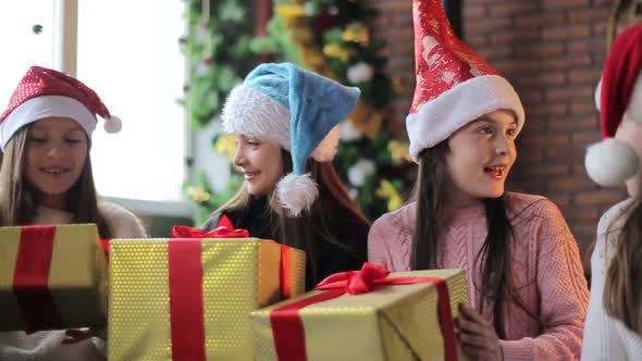 a group of children with New Year's gifts, happy friends for Christmas