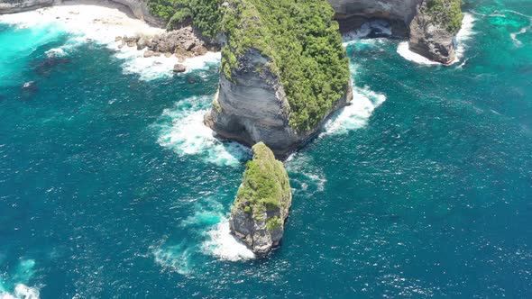 Aerial Shot of Ocean Waves on Tembeling Coastline at Nusa Penida Island, Bali Indonesia