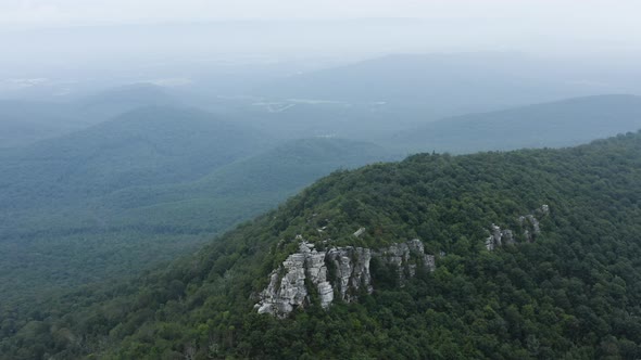 An aerial shot (clockwise orbit) of Big Schloss and Great North Mountain in the evening in the summe