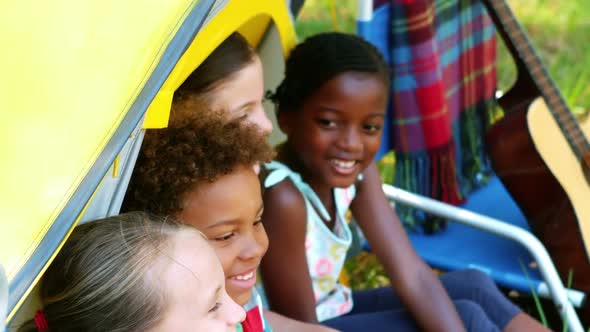 Kids having fun in tent on a sunny day