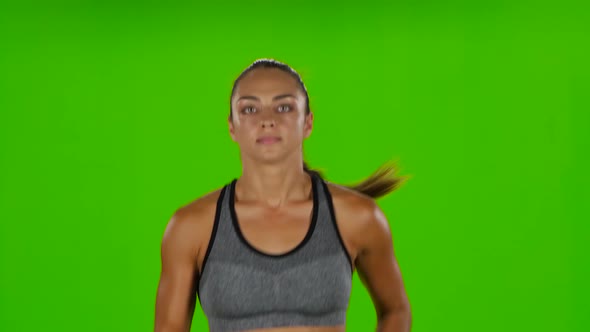 Female Runner. Front View. Green Screen