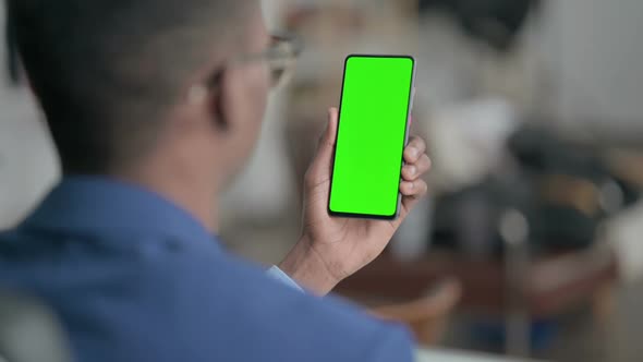 Young African Businessman Using Smartphone with Chroma Screen