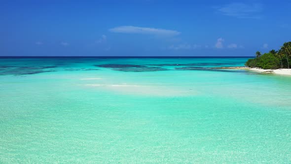 Wide aerial island view of a sandy white paradise beach and blue water background in best quality 