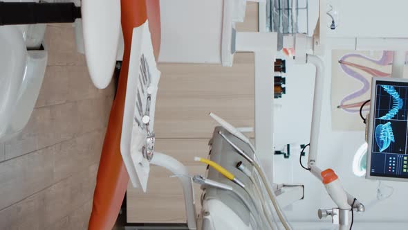 Vertical Video Interior of Modern Equipped Dental Office with x Ray on Monitors