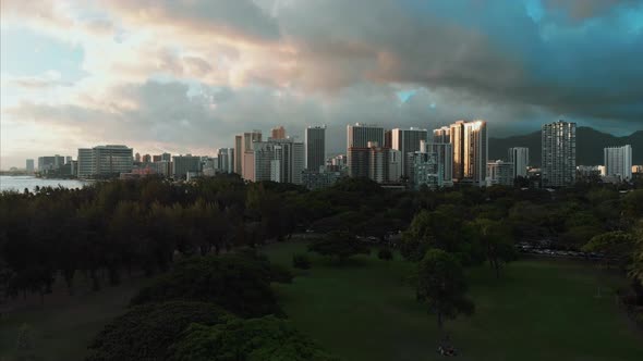 Aerial drone footage of Honolulu, Hawaii. Beautiful real estate, buildings in the city. Palm trees