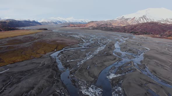 Drone Over Hvannagil Canyon And Estuary Towards Mountains