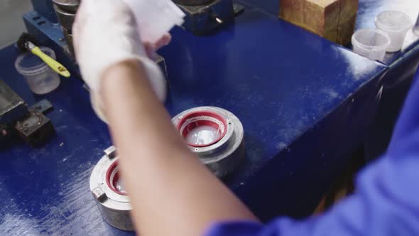 Mixed race man working in factory