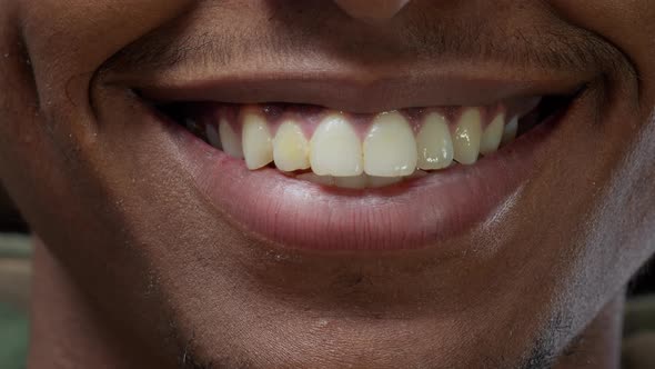 Macro Shot of African American Man Smiling in Front of Camera