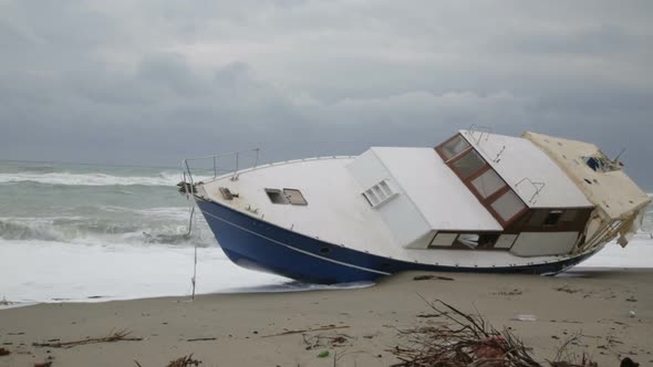 ship aground on the beach during a tempest