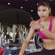 Sporty asian woman working out with battle ropes at gym. - VideoHive Item for Sale