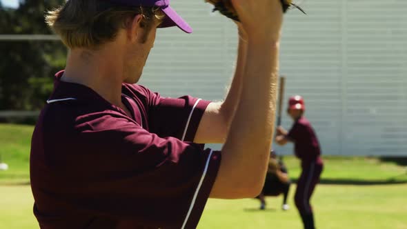 Baseball players pitching ball during practice session