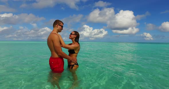 Fun lady and man in love dating on vacation live the dream on beach on white sand background 4K