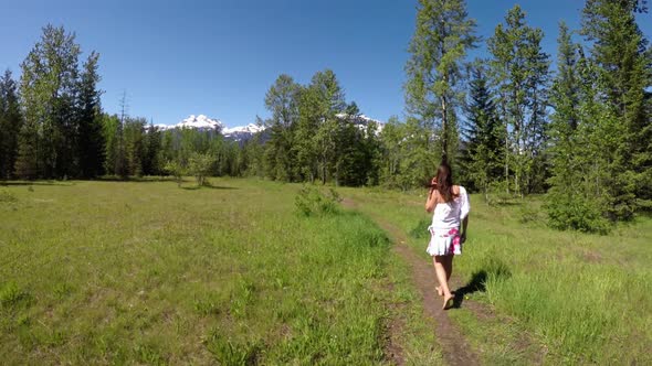 Woman walking on path 4k