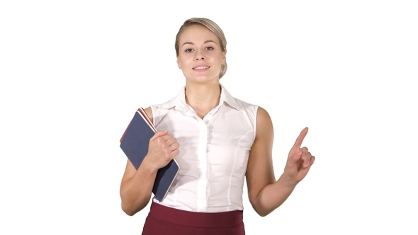 Beautiful teacher with notebooks explaining something to