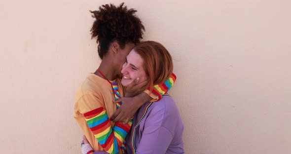 Multiracial lesbian couple having tender moment together - Homosexual love concept