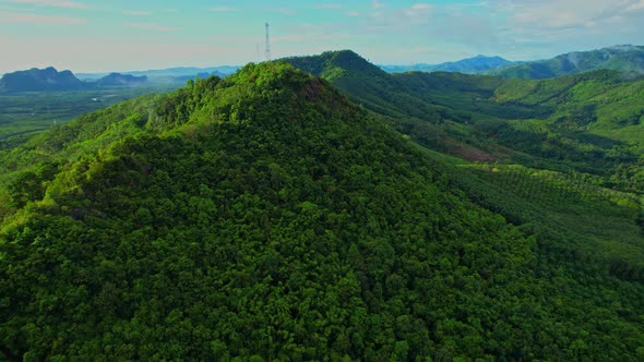 Drone flying over the mountains during sunrise