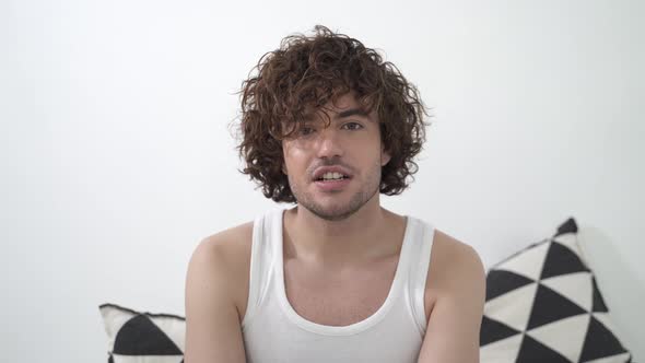 POV Young Handsome Man with Curly Hair Talking on Video Call or Virtual Meeting Online Conversation