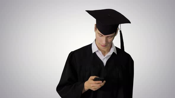 Graduate Student Walking Hand Texting Message on the Phone on Gradient Background.