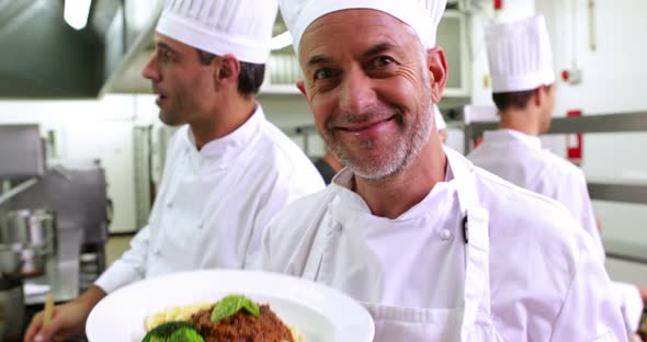 Chef Showing his Spaghetti Bolognese to Camera