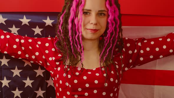 Young Woman with American Flag on Red Background