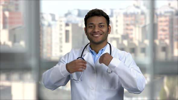 Portrait of Cheerful Indian Doctor Wearing Stethoscope