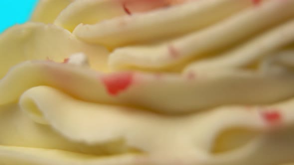 Closeup of a Cake with White Cream That is Spinning