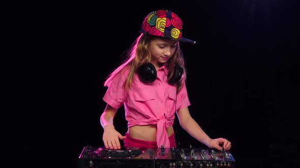 Girl in Bright Cap Playing on Dj Keyboard, Slow Motion alt