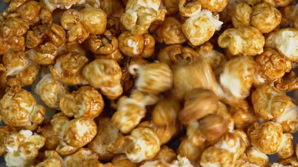 Coffee taste popcorn falls close up. Caramel popcorn. Healthy food for morning breakfast. Healthy