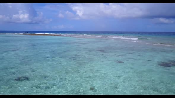 Aerial flying over panorama of beautiful lagoon beach vacation by clear ocean and white sand backgro