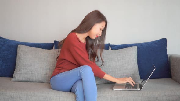 Young asian woman use laptop