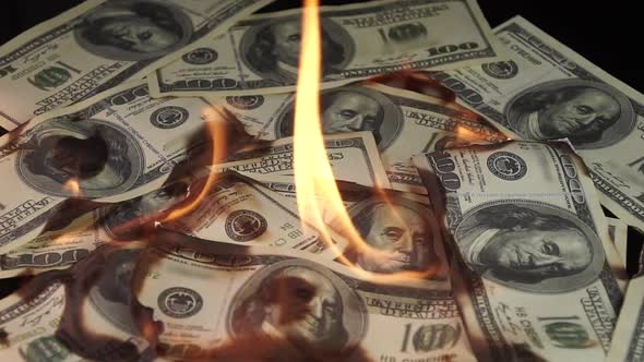 Slow Motion of Dollars Money on Fire Lost Money