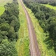 Railroad through green grassed countryside, Aerial - VideoHive Item for Sale
