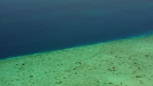 Close up tourism of sea view beach break by blue water with sand background near reef