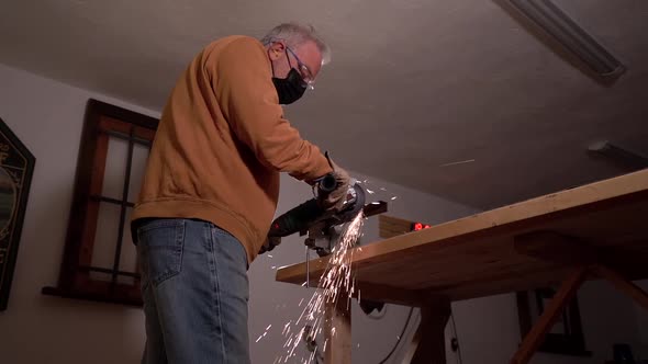 Professional welder in mask in workshop