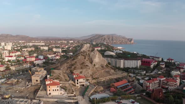 Panoramic View From Drone Above Sudak City on Black Sea Shore. Aerial Landscape Modern City Center