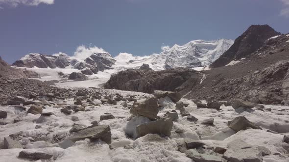 Large Stones Emerge From An Alpine Glacier