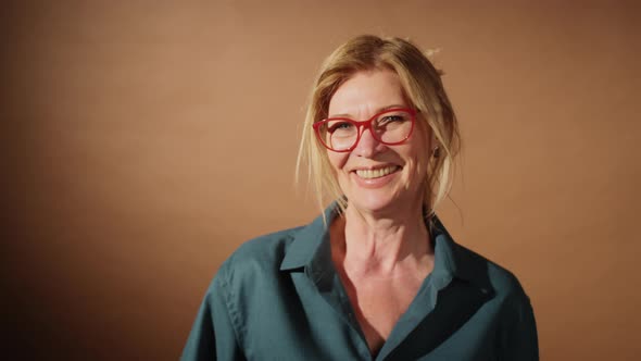 Senior Fashion Model Smiling and Posing for Camera in Studio