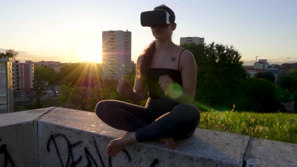 Young woman using cyber glasses during training in the evening