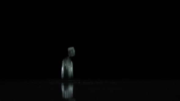 Broken Glass Falls To the Floor. Black Background. Slow Motion