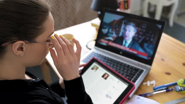 Girl Hand on a Black Clothes Holding Tablet Studying Monitoring the News of Vaccination on the