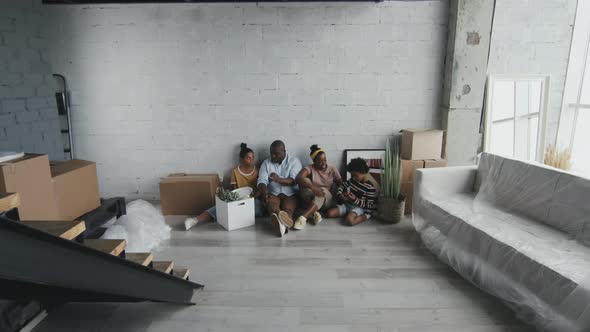 African-American Parents and Kids in New House