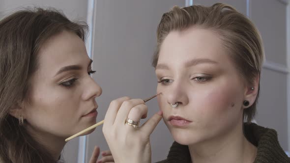 Close Up Shot of Professional Makeup Artist Working with Model in Visage Studio