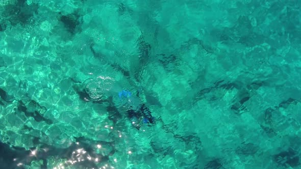 Aerial View of Divers Swimming Underwater Sea