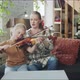 The Tutor Helps the Girl to Play the Violin and Adjusts the Bow - VideoHive Item for Sale