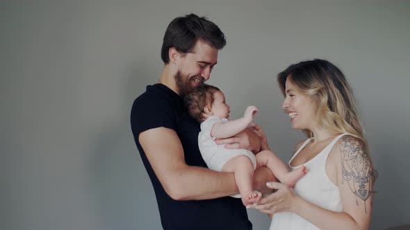 Love Emotions of Happy Cheerful Family with Little Infant