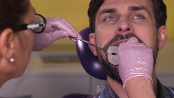 Portrait of Man Having Tooth Treatment