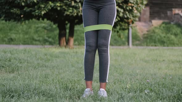 Fitness Woman Working Out with Resistance Band